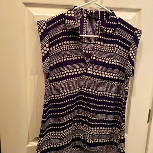 Navy Blue and Cream colored cap sleeve blouse.